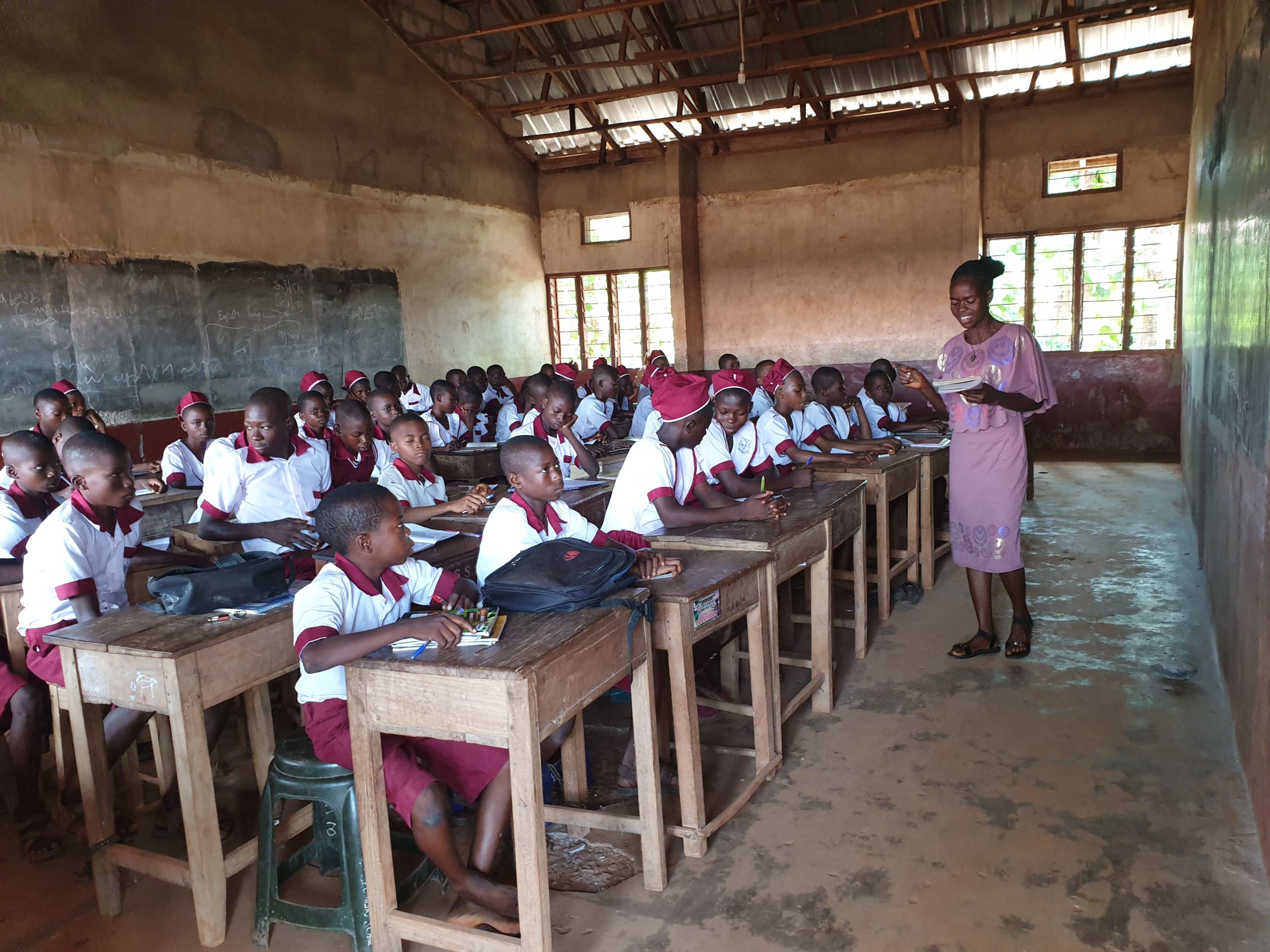Nigerian pupils attending a lesson in a classroom